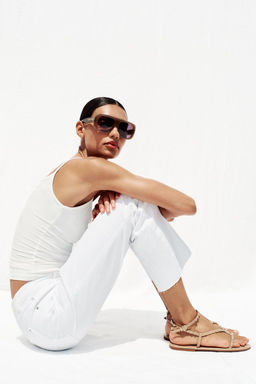 SANDALS WITH METALLIC BEADED STRAPS