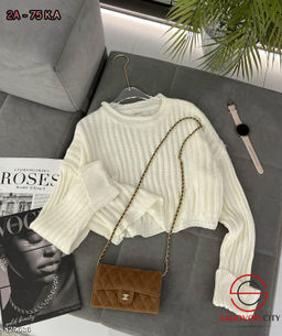 Пуловер вязаный в рубчик