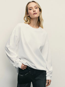 Лонгслив оверсайз с манжетами и принтом на рукаве / Zarina