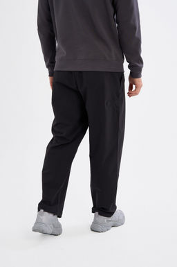 Брюки текстильные Черный ICONIC Woven Track Pants - Anta фото 5