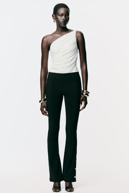 FLARE LEGGINGS WITH BUTTON HEMS