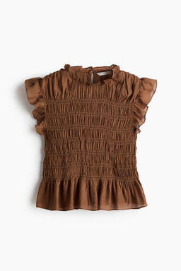 Top nido de abeja con peplum