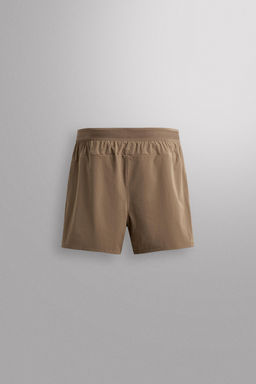 PANTALONES CORTOS T?CNICOS TRAINING / Marr?n claro