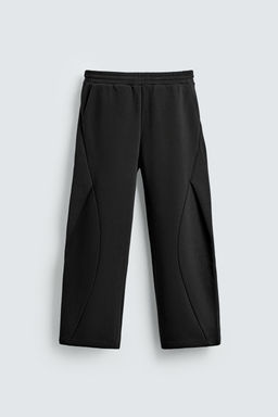 NEOPRENE-EFFECT PLEATED BALLOON FIT TROUSERS