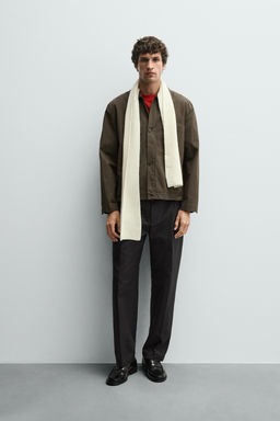 TEXTURED PLEATED TROUSERS