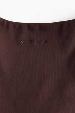 Top de deporte SoftMove con detalle girado - H&m фото 5