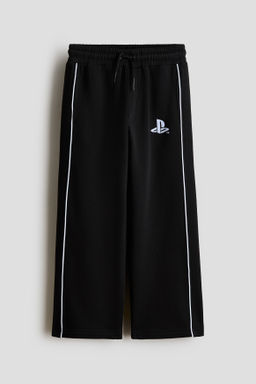 Joggers con motivo estampado e interior cepillado