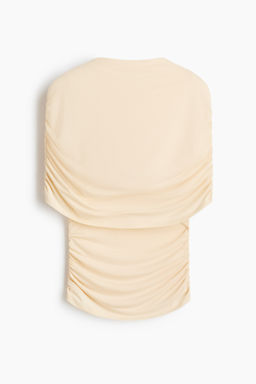 Top drapeado con capa decorativa