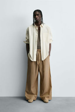 STRIPED OVERSIZE FIT TROUSERS
