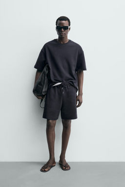 BERMUDA JOGGER RELAXED FIT INTERLOCK / Azul profundo