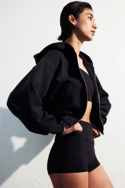Chaqueta de deporte con capucha y cremallera