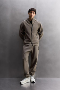 TECHNICAL TROUSERS WITH ZIPS