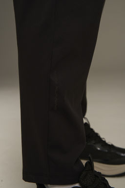 Брюки трикотажные утепленные Черный ANTA RUNNING Knit Track Pants