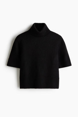 Top de punto con cuello alto