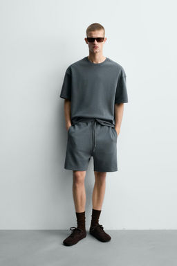 BERMUDA JOGGER RELAXED FIT INTERLOCK / verde lavado
