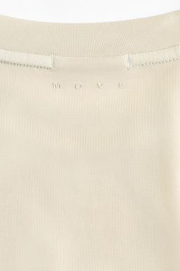 Camiseta de deporte boxy con DryMove Loose Fit - H&m фото 11