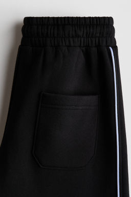 Joggers con motivo estampado e interior cepillado - H&m фото 2