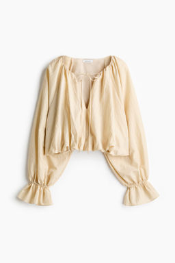 Blusa globo con efecto arrugado