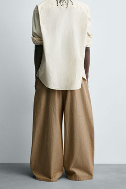 STRIPED OVERSIZE FIT TROUSERS
