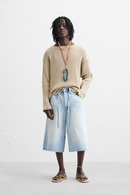 RIBBED SWEATER WITH RIPPED FINISH