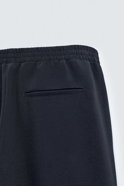 FLOWING TROUSERS WITH ZIPS