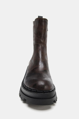 DISTRESSED-EFFECT PLATFORM ANKLE BOOTS