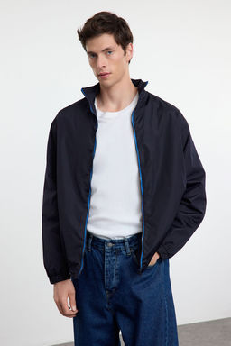 TRENDYOL MAN Lacivert Regular Fit Fermuarl? Ince Mevsimlik Ruzgarl?k&Yagmurluk Ceket Mont TMNAW25MO00040