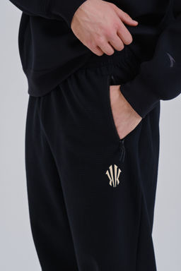 Брюки трикотажные Черный NATURAL POWER Knit Track Pants - Anta фото 4