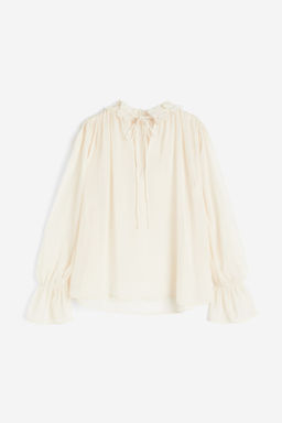 Blusa de gasa con aplicaciones