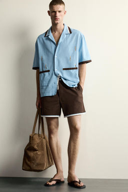 CAMISA RELAXED FIT BORDADO NADADORES / Celeste