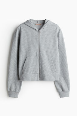 Chaqueta sudadera gofrada con capucha y cremallera