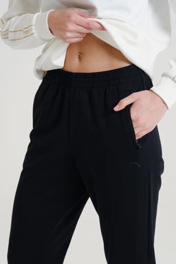 Брюки трикотажные удлиненные Черный TRN ESSENTIAL Knit Track Pants - Anta фото 3