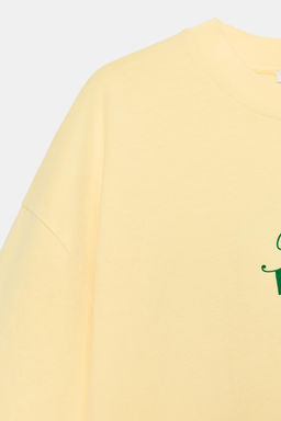 CAMISETA EFECTO LAVADO TEXTO / Amarillo
