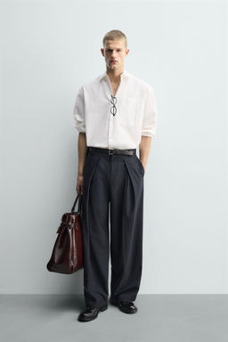 RELAXED FIT PLEATED TROUSERS