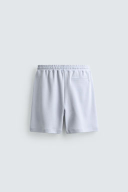 BERMUDA JOGGER RELAXED FIT INTERLOCK / Celeste