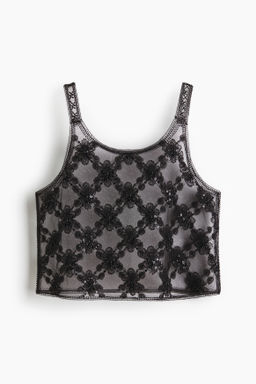 Top de malla con detalles decorativos