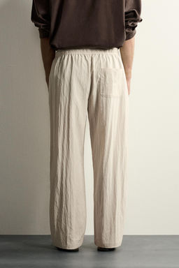 PANTAL?N T?CNICO RELAXED FIT EFECTO ARRUGADO / Beige - Zara фото 3