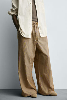 STRIPED OVERSIZE FIT TROUSERS