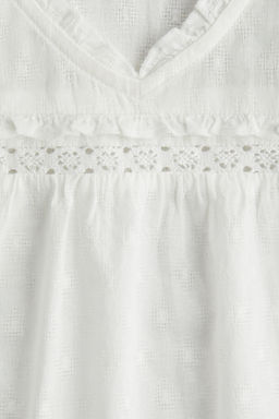 Blusa de algod?n con ribetes de volante