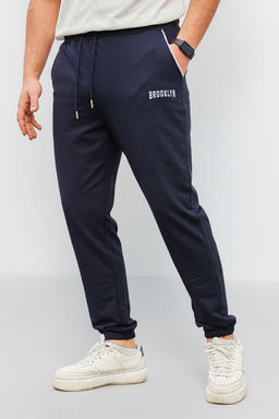 Lacivert Regular Fit Bask?l? Biyeli Lastik Paca Esofman Alt? TMNSS22EA0121