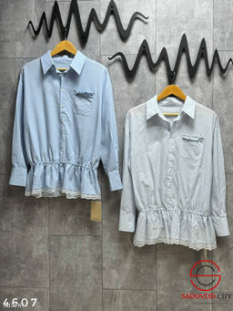 Рубашка на резинке снизу с вышивкой на кармане