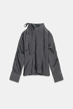BLOUSE WITH SHOULDER OPENING AND BOW