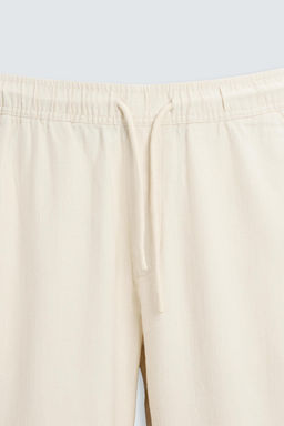 RELAXED FIT TEXTURED TROUSERS - Zara фото 42
