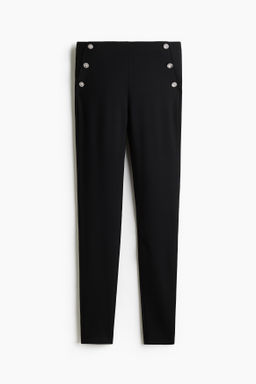 Leggings con botones decorativos