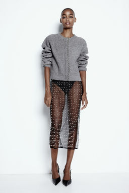 Cardigan en punto de canale con cuentas