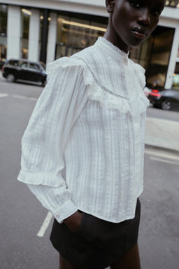 BLOUSE WITH LACE TRIM AND RUFFLES