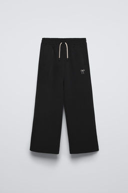 WIDE-LEG TROUSERS WITH EMBROIDERED BOW