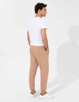 Бежевые зауженные брюки из эластичного трикотажа - Cacharel фото 4