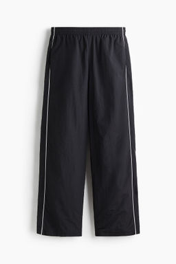 Pantal?n de ch?ndal en nailon Relaxed Fit