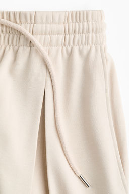 Pantal?n con cord?n de ajuste y pliegue decorativo - H&m фото 7